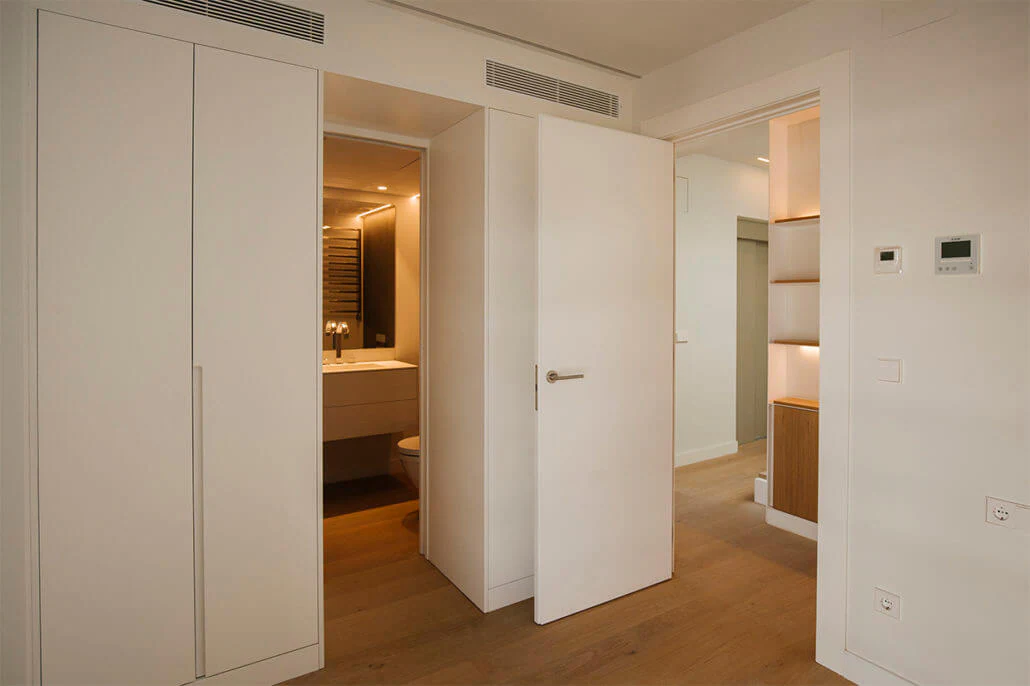 Interior passage in a home with lighting integrated into the furniture