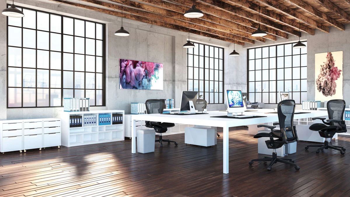 Workspace with an industrial structure and suspended luminaires