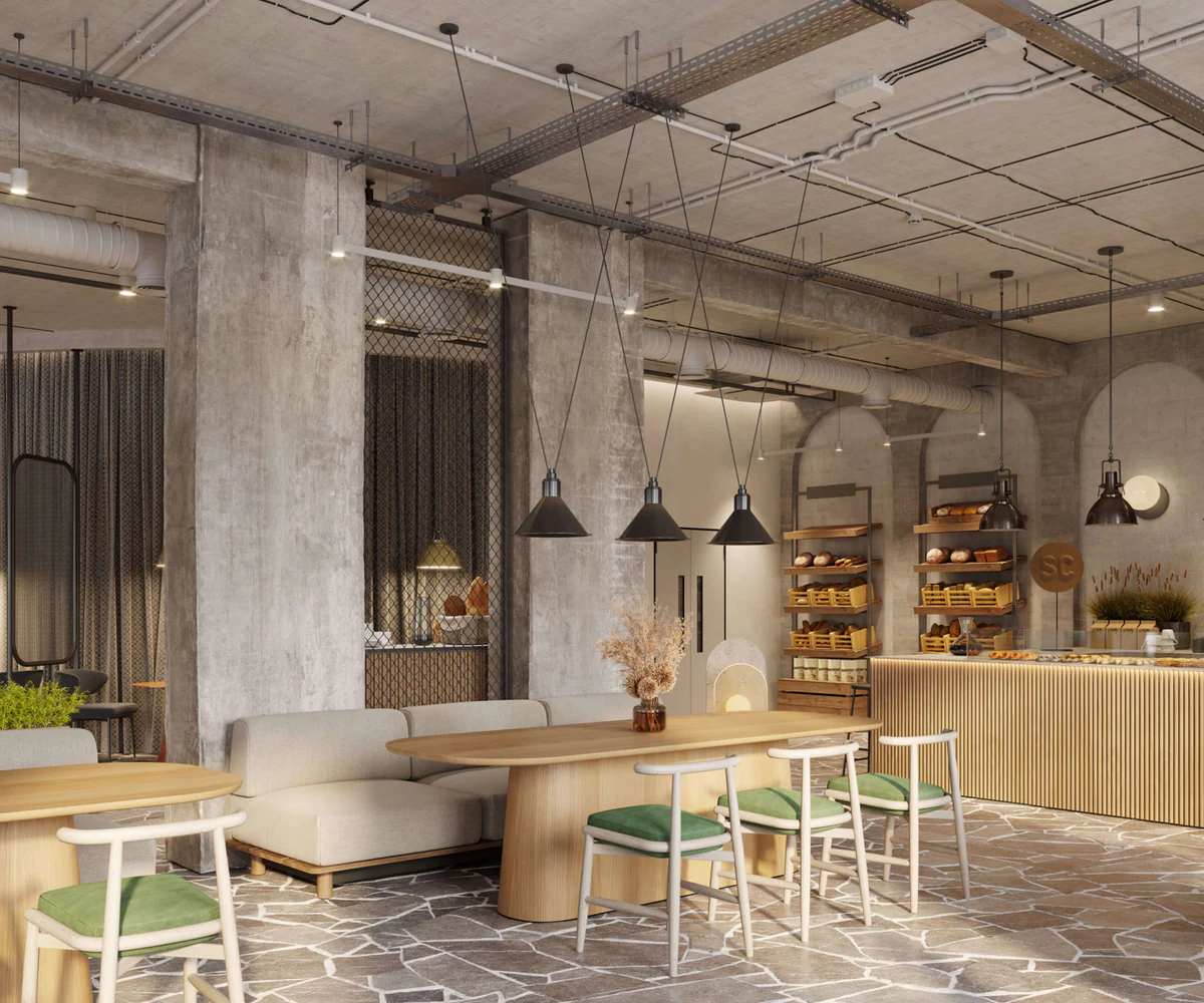 Bar and tables under suspended luminaires in a concrete interior